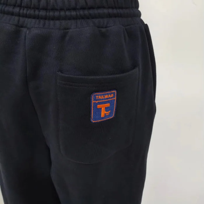Close-up of the tailbox patch on the back pocket of the trackies